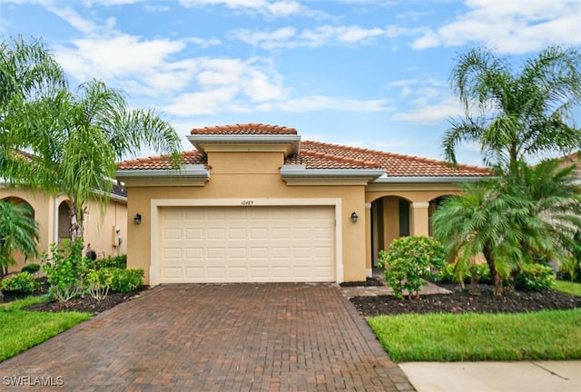 mediterranean / spanish-style house featuring a garage