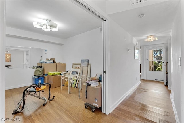 interior space with hardwood / wood-style floors and a chandelier