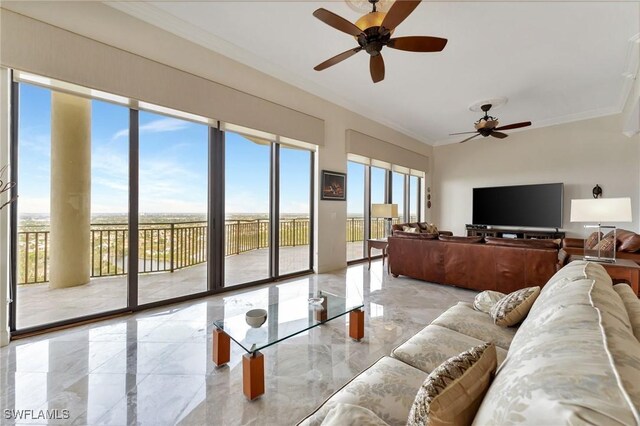 living room with ceiling fan and ornamental molding