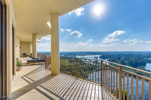 balcony featuring a water view