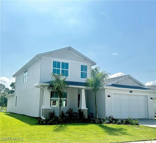 view of front of house featuring a front yard and a garage