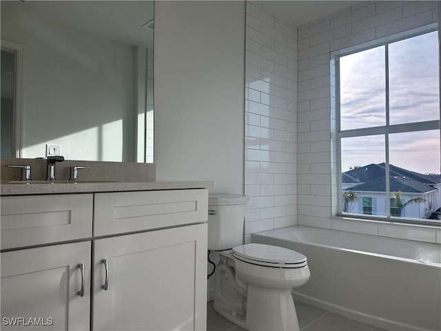 bathroom with vanity, tile patterned floors, and toilet