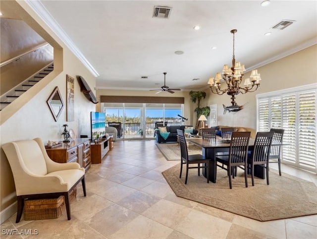 dining area featuring ceiling fan with notable chandelier, light tile patterned floors, and crown molding