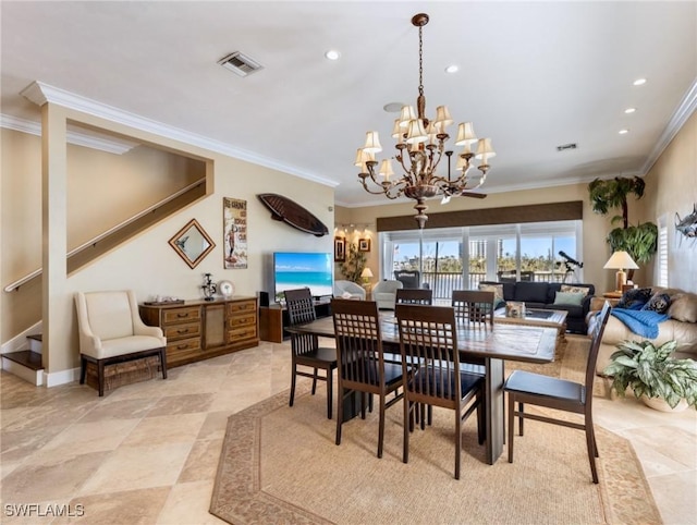 dining room featuring ornamental molding and a notable chandelier