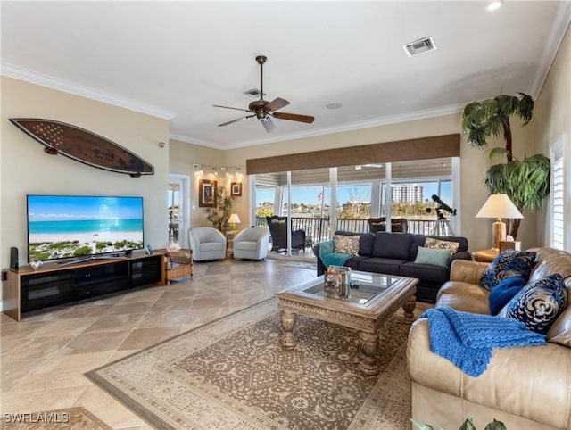 living room with ceiling fan and ornamental molding