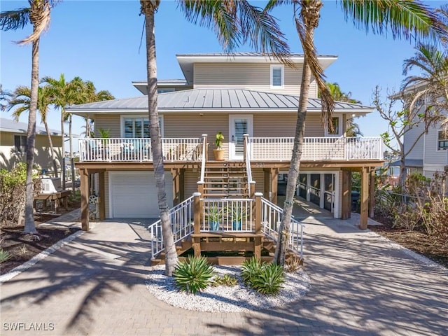 view of front of home featuring a garage and covered porch