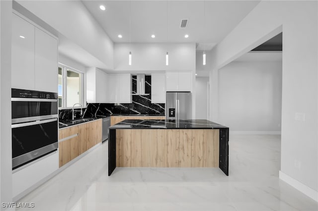 1027 NW 40th Pl, Cape Coral, FL 33993 - kitchen featuring tasteful backsplash, marble finish floor, modern cabinets, and stainless steel appliances