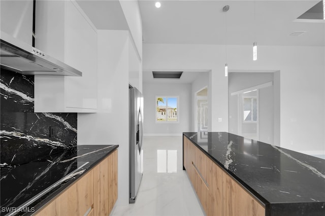 1027 NW 40th Pl, Cape Coral, FL 33993 - kitchen with stainless steel fridge with ice dispenser, dark stone countertops, backsplash, wall chimney exhaust hood, and modern cabinets