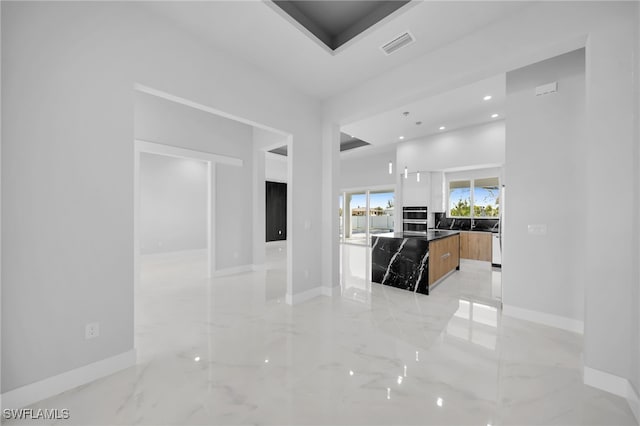 1027 NW 40th Pl, Cape Coral, FL 33993 - hall featuring marble finish floor, baseboards, and visible vents