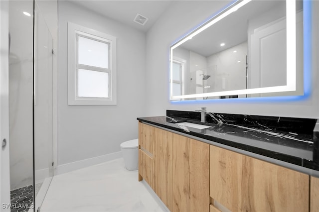 1027 NW 40th Pl, Cape Coral, FL 33993 - bathroom with visible vents, baseboards, toilet, a shower stall, and vanity