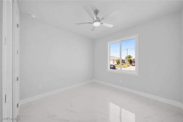 1027 NW 40th Pl, Cape Coral, FL 33993 - unfurnished room featuring baseboards and ceiling fan