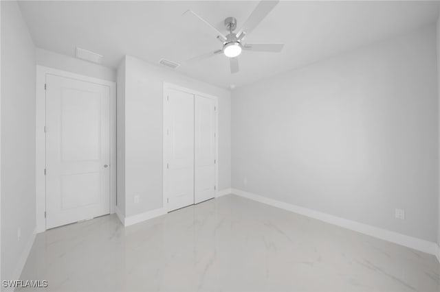 1027 NW 40th Pl, Cape Coral, FL 33993 - unfurnished bedroom featuring a closet, visible vents, marble finish floor, and baseboards