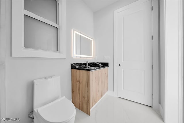 1027 NW 40th Pl, Cape Coral, FL 33993 - bathroom featuring toilet and vanity