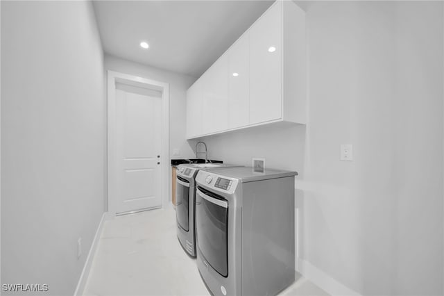1027 NW 40th Pl, Cape Coral, FL 33993 - laundry room with recessed lighting, separate washer and dryer, baseboards, and cabinet space