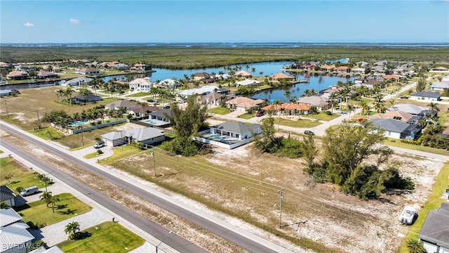 1027 NW 40th Pl, Cape Coral, FL 33993 - bird's eye view with a residential view and a water view