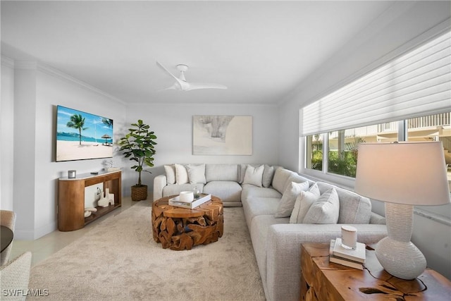 tiled living room with crown molding and ceiling fan