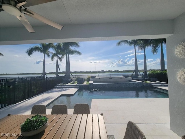 view of swimming pool with a patio area and ceiling fan