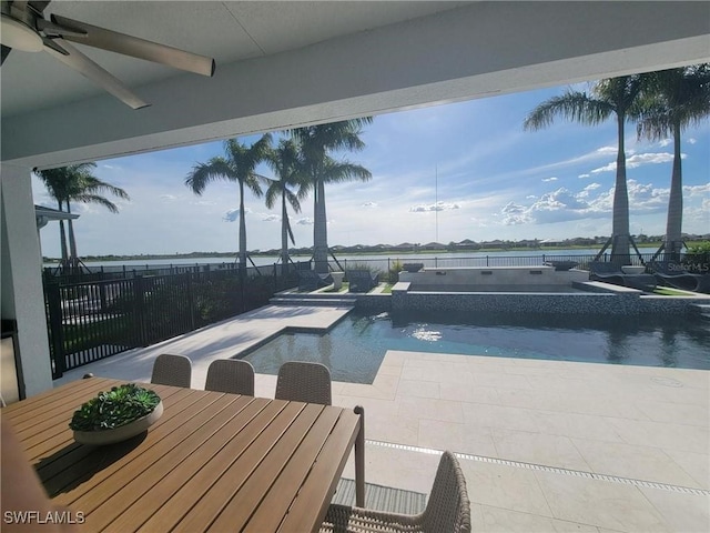 view of swimming pool with an in ground hot tub, ceiling fan, and a patio area