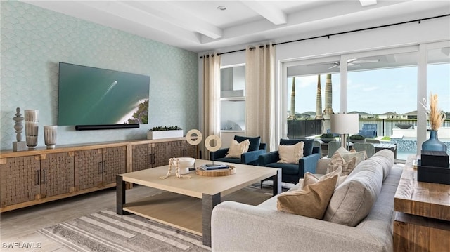 living room featuring beam ceiling, ceiling fan, and wood-type flooring