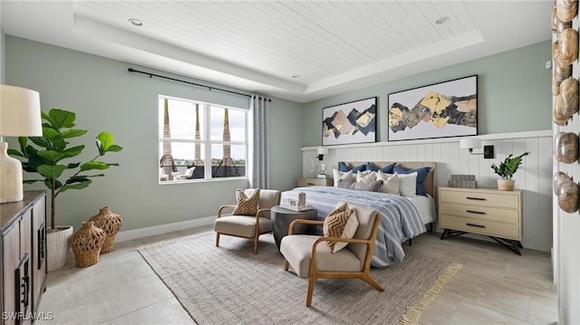 tiled bedroom with a raised ceiling and wooden ceiling