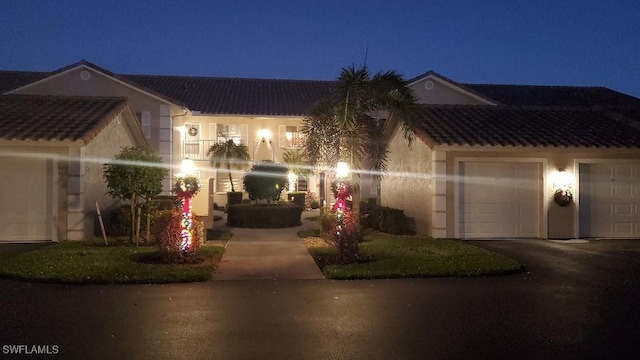 view of front of property with a balcony