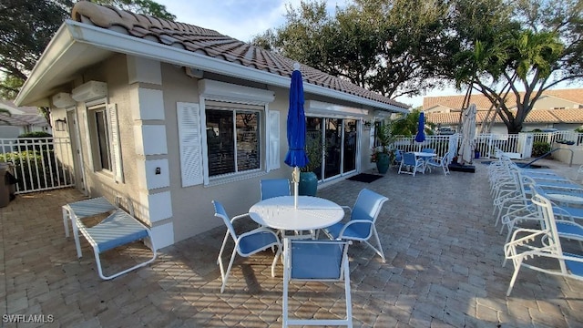 view of patio with a wall mounted AC