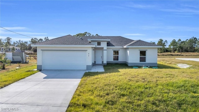 view of front facade with a garage and a front yard