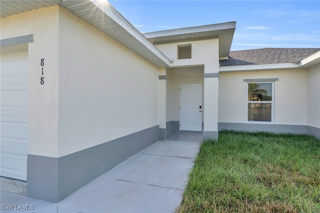 entrance to property with a garage