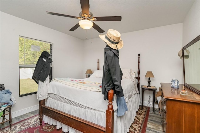 bedroom with ceiling fan and wood-type flooring