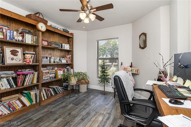 office with ceiling fan and dark hardwood / wood-style flooring