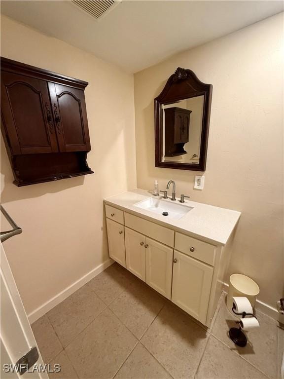 bathroom featuring tile patterned floors and vanity