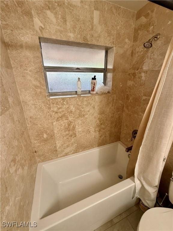 bathroom with toilet, shower / bathtub combination with curtain, and tile patterned flooring