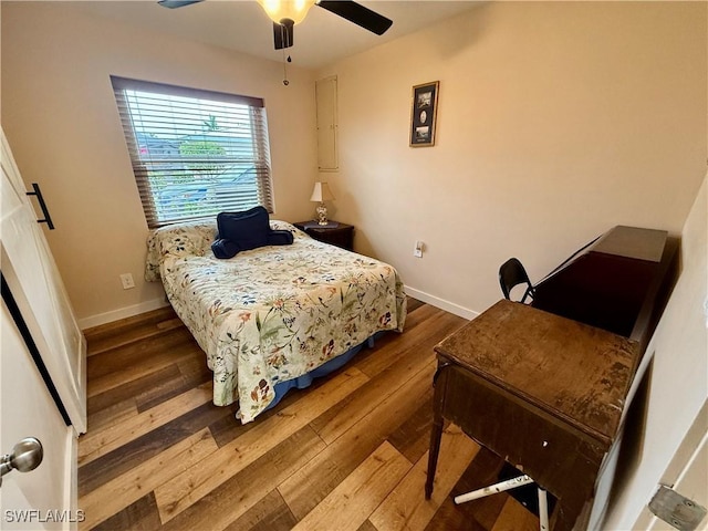 bedroom featuring ceiling fan and hardwood / wood-style floors