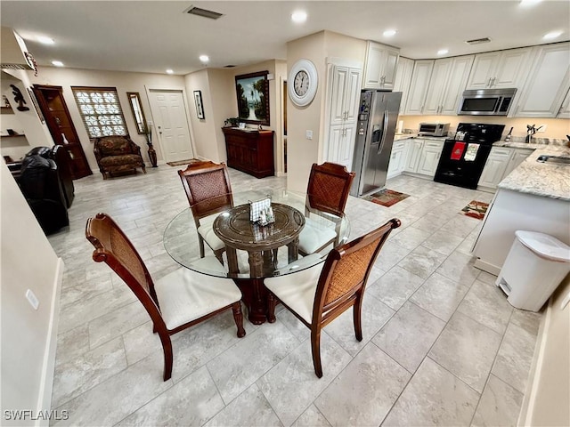 dining room featuring sink