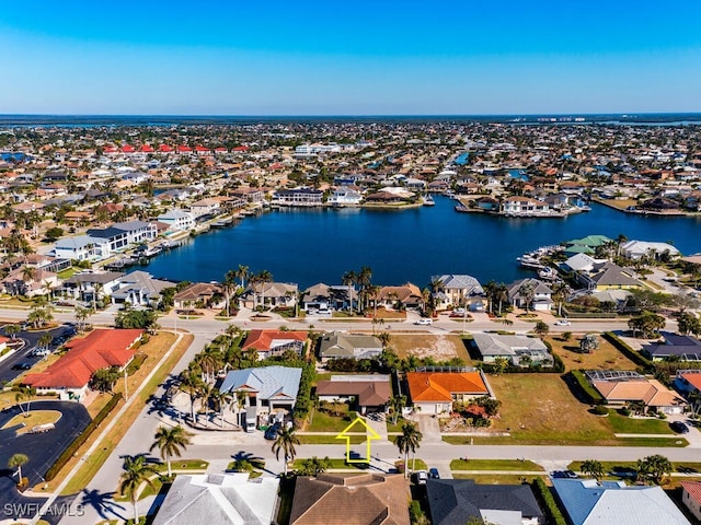 bird's eye view featuring a residential view and a water view