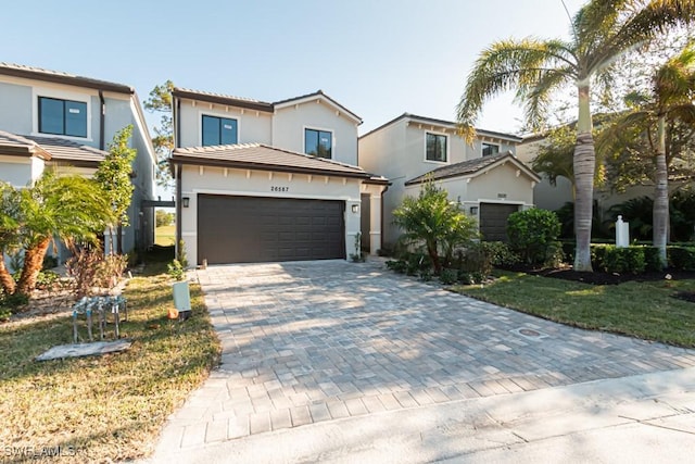 view of front facade featuring a front lawn and a garage