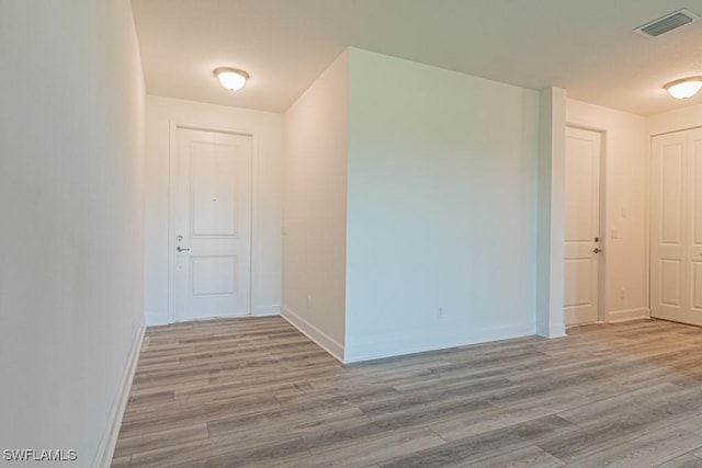 spare room with light wood-type flooring