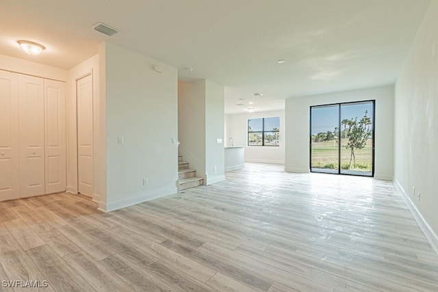 spare room featuring light hardwood / wood-style floors