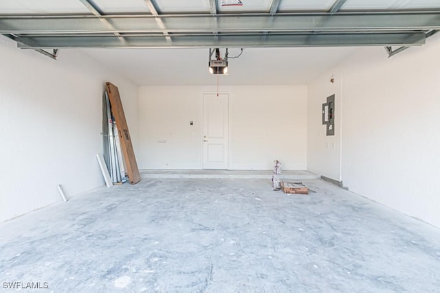 garage featuring electric panel and a garage door opener