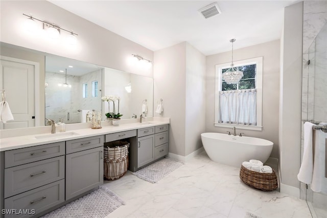 bathroom with vanity and separate shower and tub