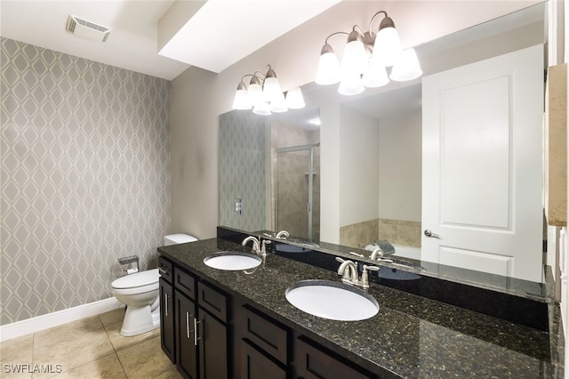 full bathroom with a notable chandelier, tile patterned floors, toilet, vanity, and shower with separate bathtub