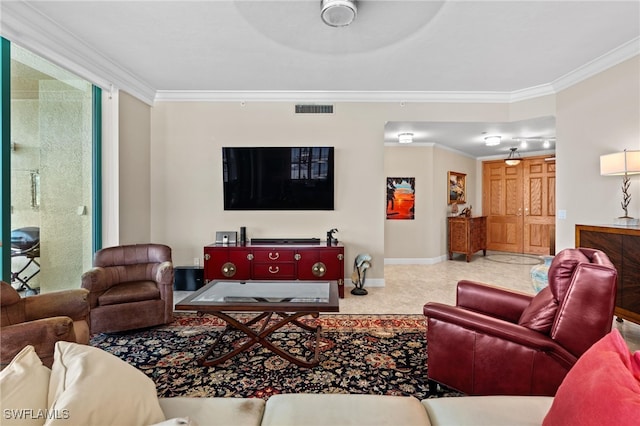 living room featuring ceiling fan, ornamental molding, and carpet floors