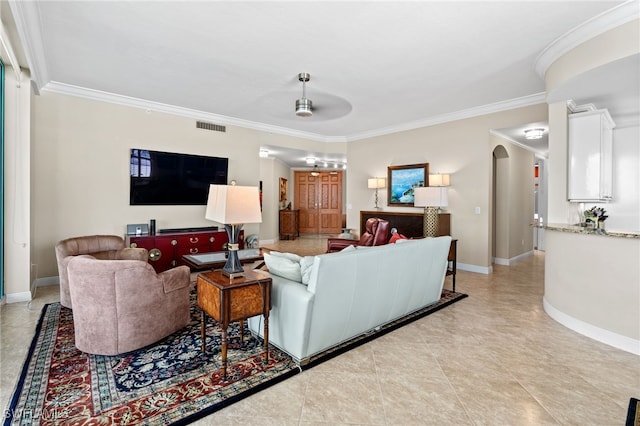 living room featuring ceiling fan, light tile patterned floors, and crown molding