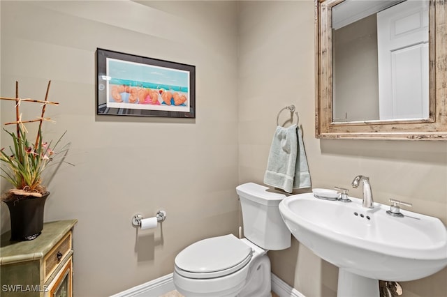 bathroom with toilet and sink