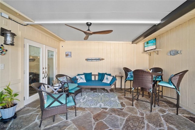 exterior space featuring ceiling fan, french doors, and beamed ceiling