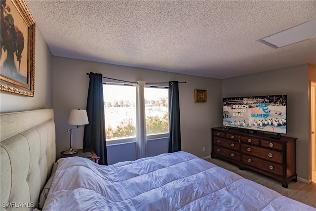 3 Bob O Link Ct Unit 3B, Naples, FL 34105 - bedroom with a textured ceiling and attic access
