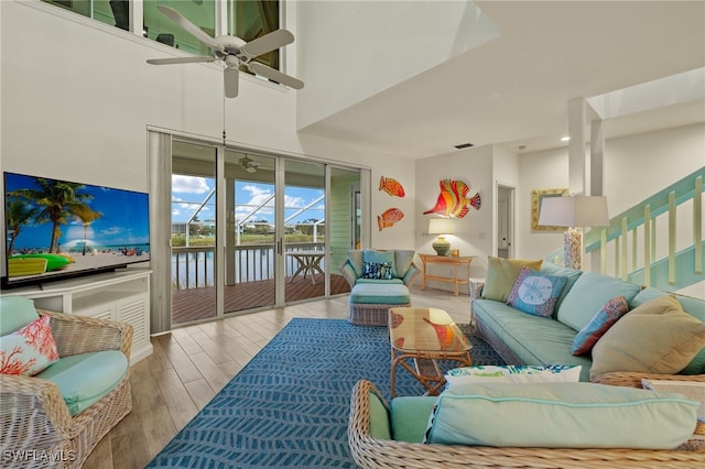 sunroom / solarium featuring ceiling fan