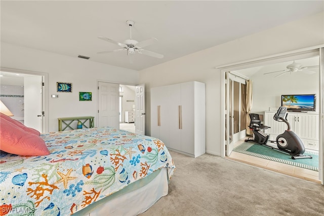 bedroom with ceiling fan and light colored carpet