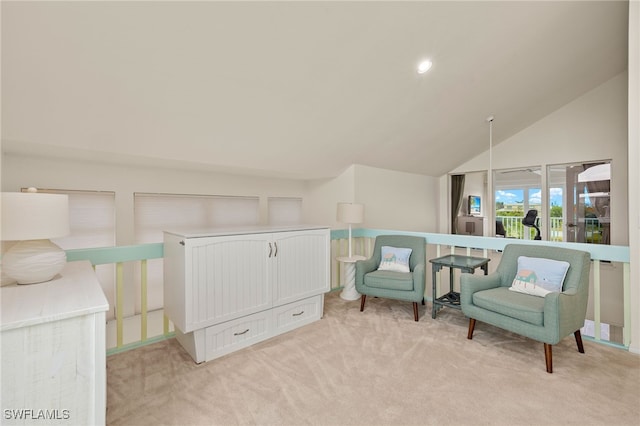 living area with light colored carpet and lofted ceiling