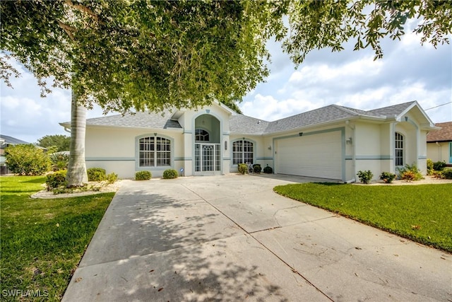 ranch-style house featuring a garage and a front lawn